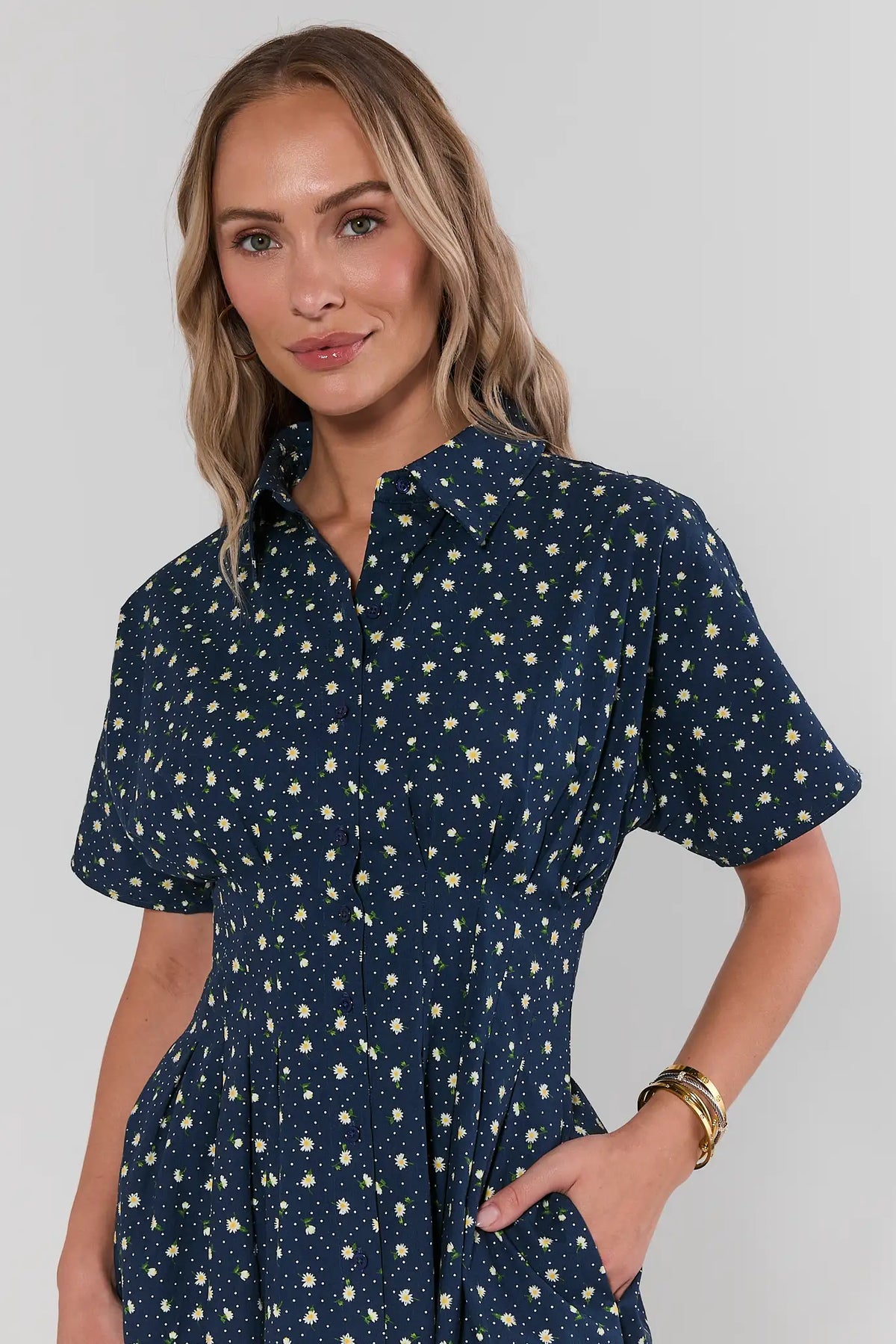 Close-up of navy daisy floral button-up dress collar and short sleeves, modest neckline | Avara