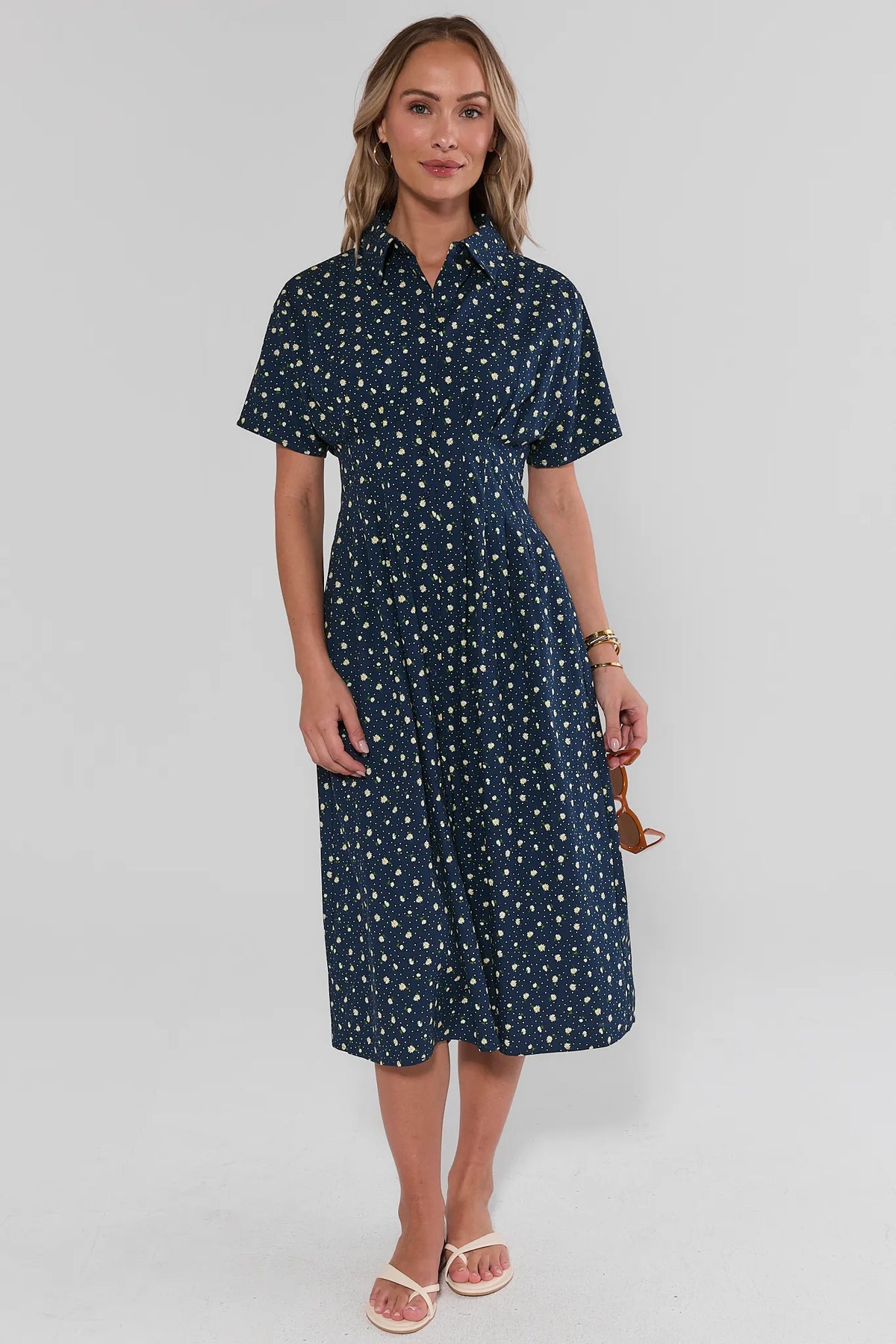 Navy floral modest maxi dress full-length front view, styled with sandals | Avara