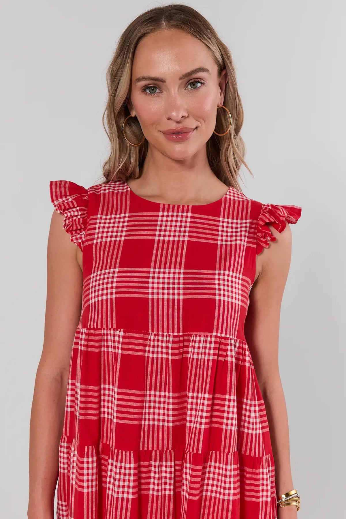 Red and white plaid flutter sleeve midi dress, ruffle shoulder close-up detail | Avara