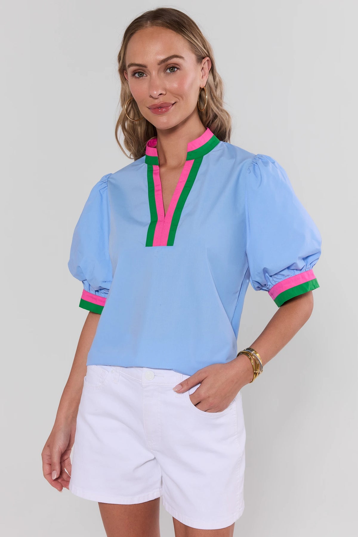 Adelaide Blue Contrast Trim Puff Sleeve Top with pink and green neckline, styled with white shorts - Front View | Avara