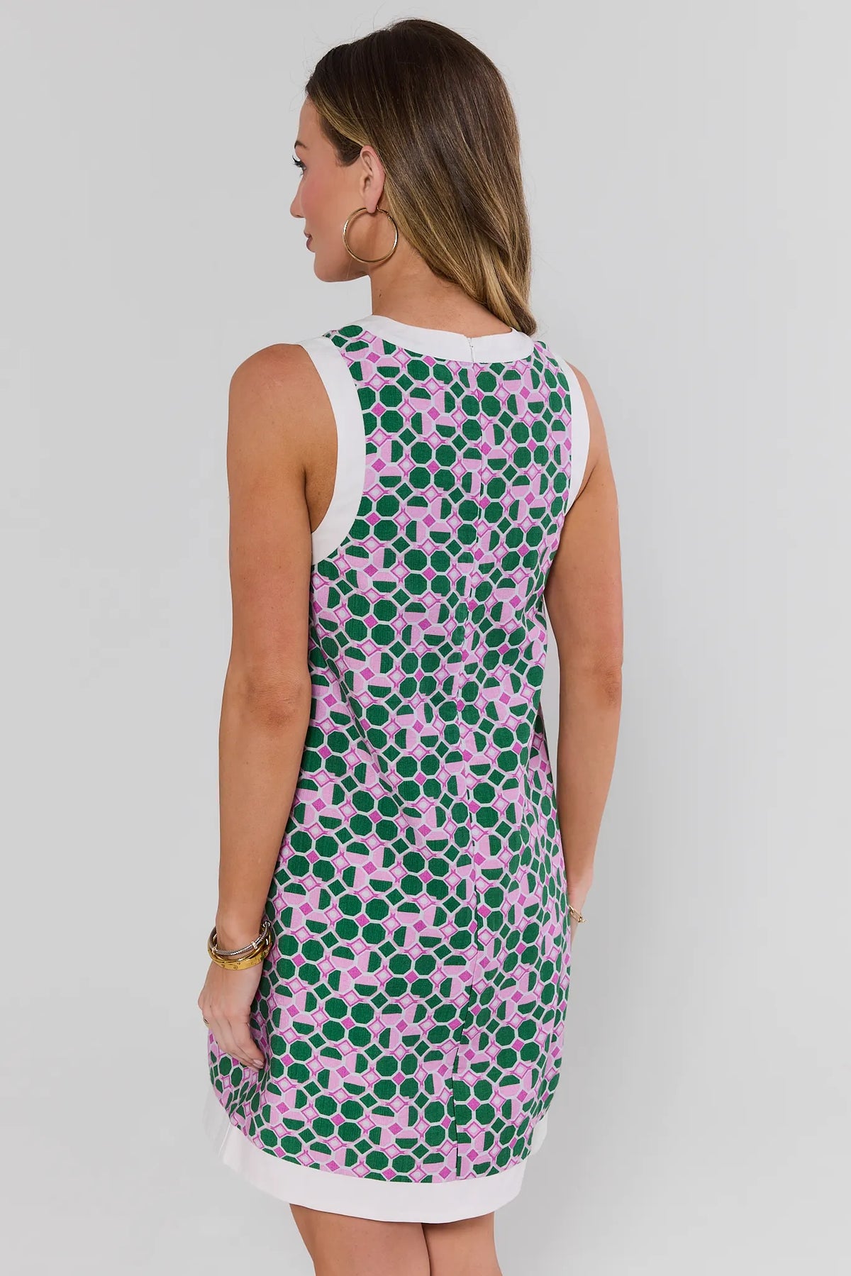 Green pink printed contrast trim mini dress back view showing white trim hem detail - Back View | Avara