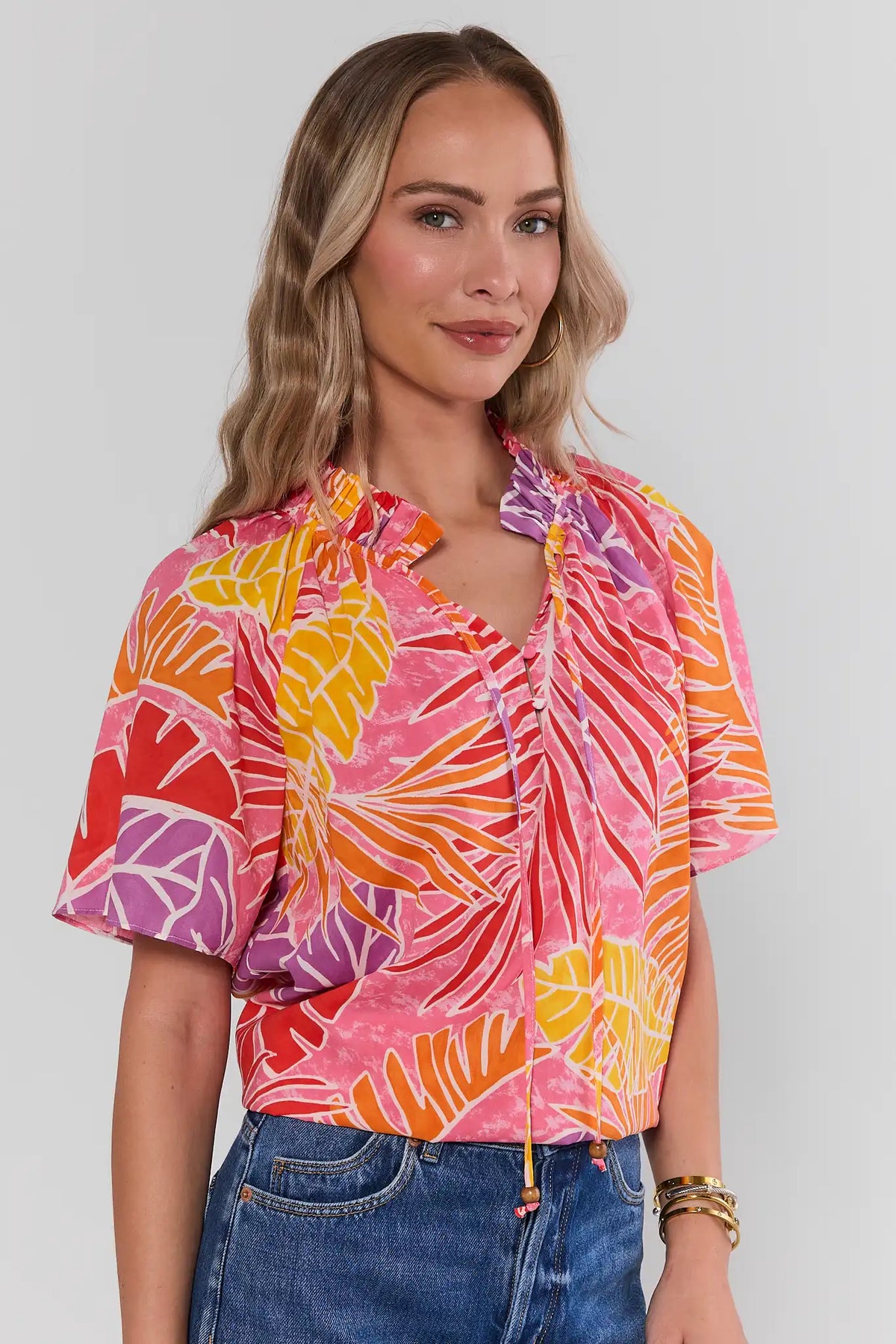 Pink Palm Print Split Neck Top, three-quarter front view, relaxed silhouette with vibrant tropical print | Avara