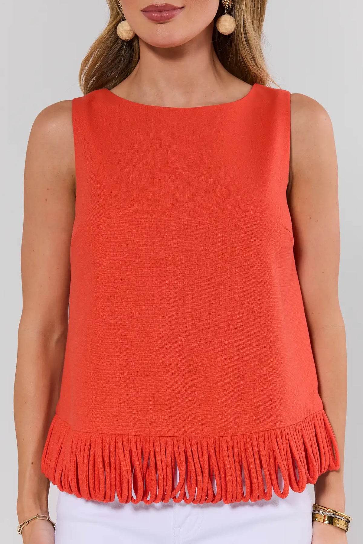 Angelina Orange Fringe Top - Close-Up Detail, looped fringe hemline and bateau neckline | Avara