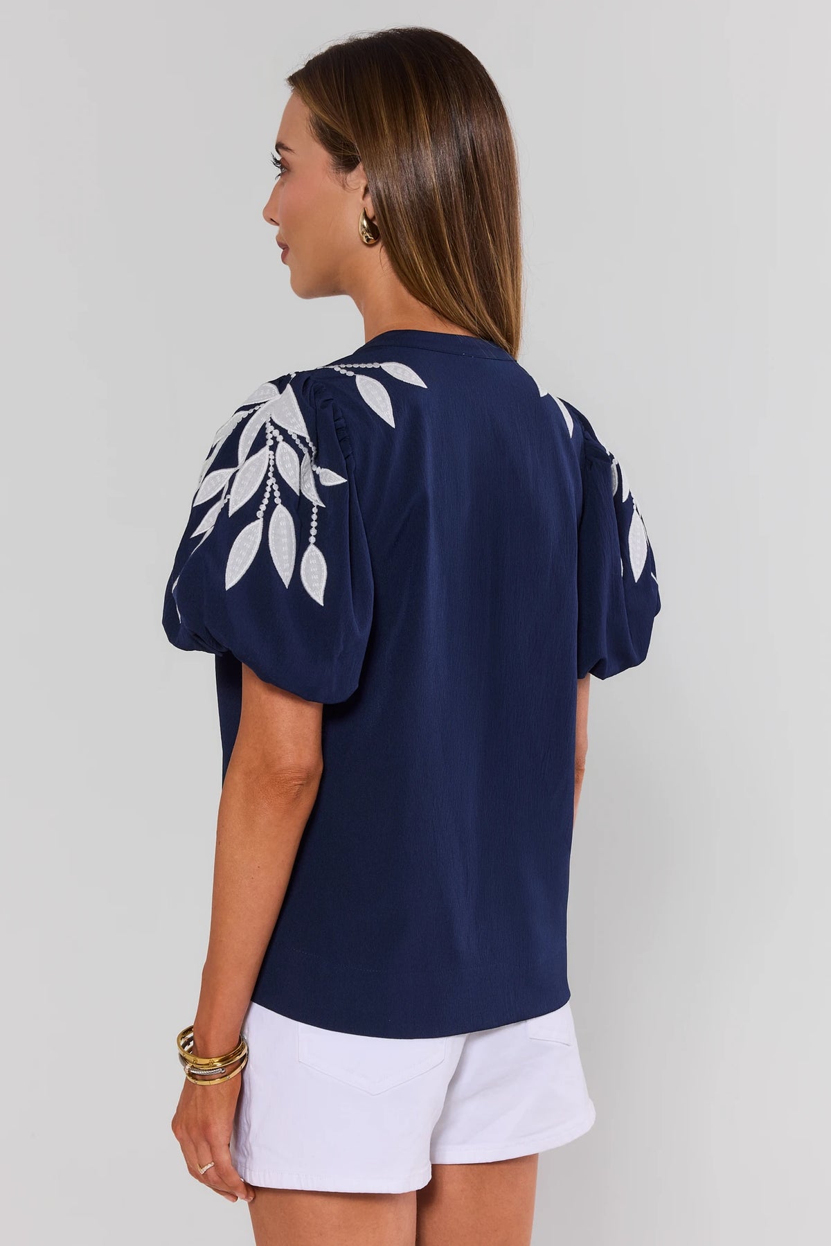 Beth Navy Embroidered Top back view showing clean navy silhouette and embroidered puff sleeves, women's top | Avara