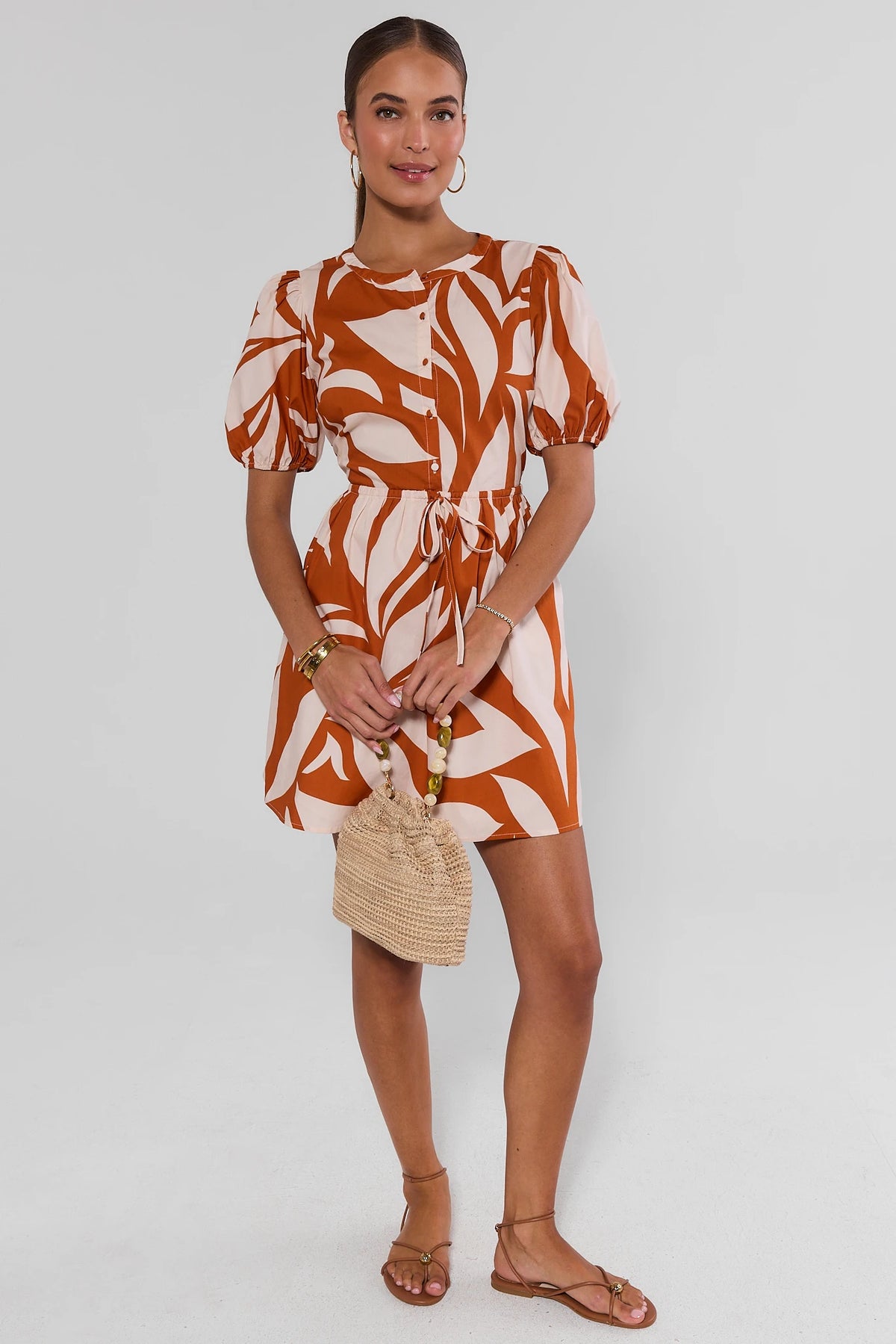 Orange abstract leaf print short dress with puff sleeves and tie waist - Full Front View | Avara