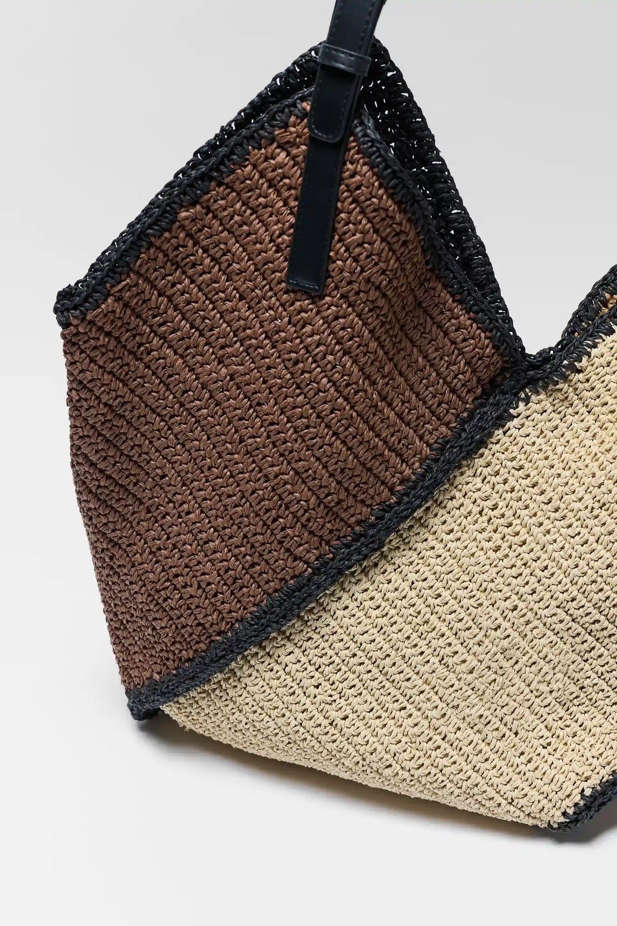 Brown and cream woven texture close-up with black trim detail - Fabric Detail | Avara
