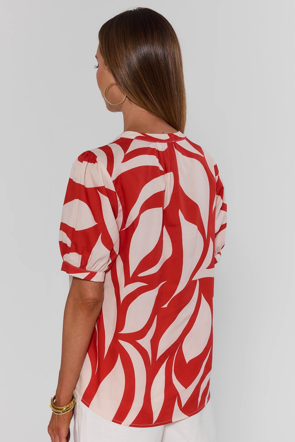 Jess Red Printed Puff Sleeve Top back view showing bold red abstract print and puff sleeve detail | Avara