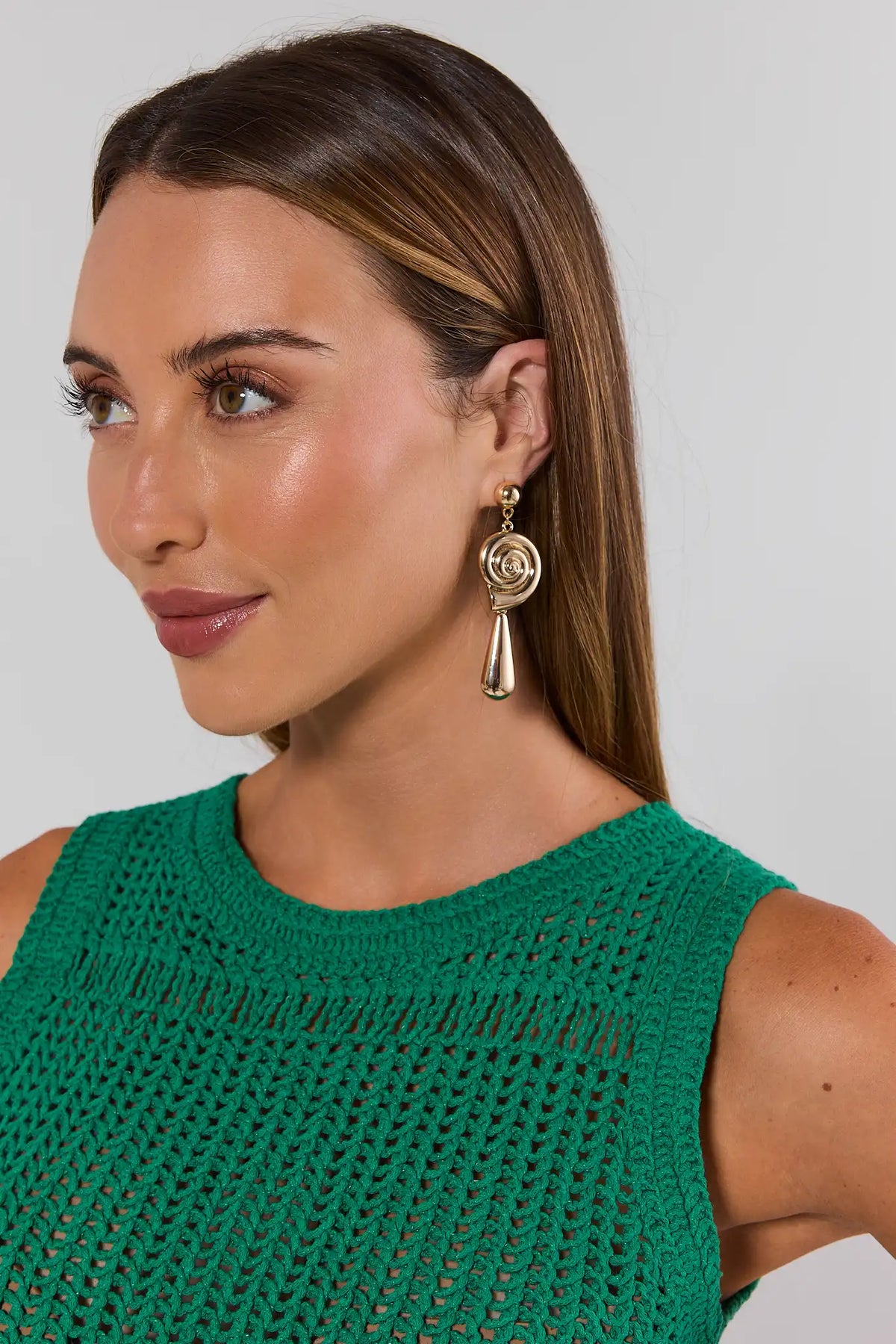 Woman wearing gold shell drop earrings with green crochet top - On Model Side View | Avara