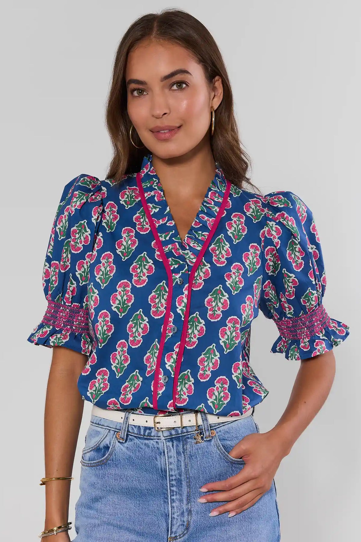Navy floral smocked top styled with light wash denim jeans and white belt - On Model Front | Avara