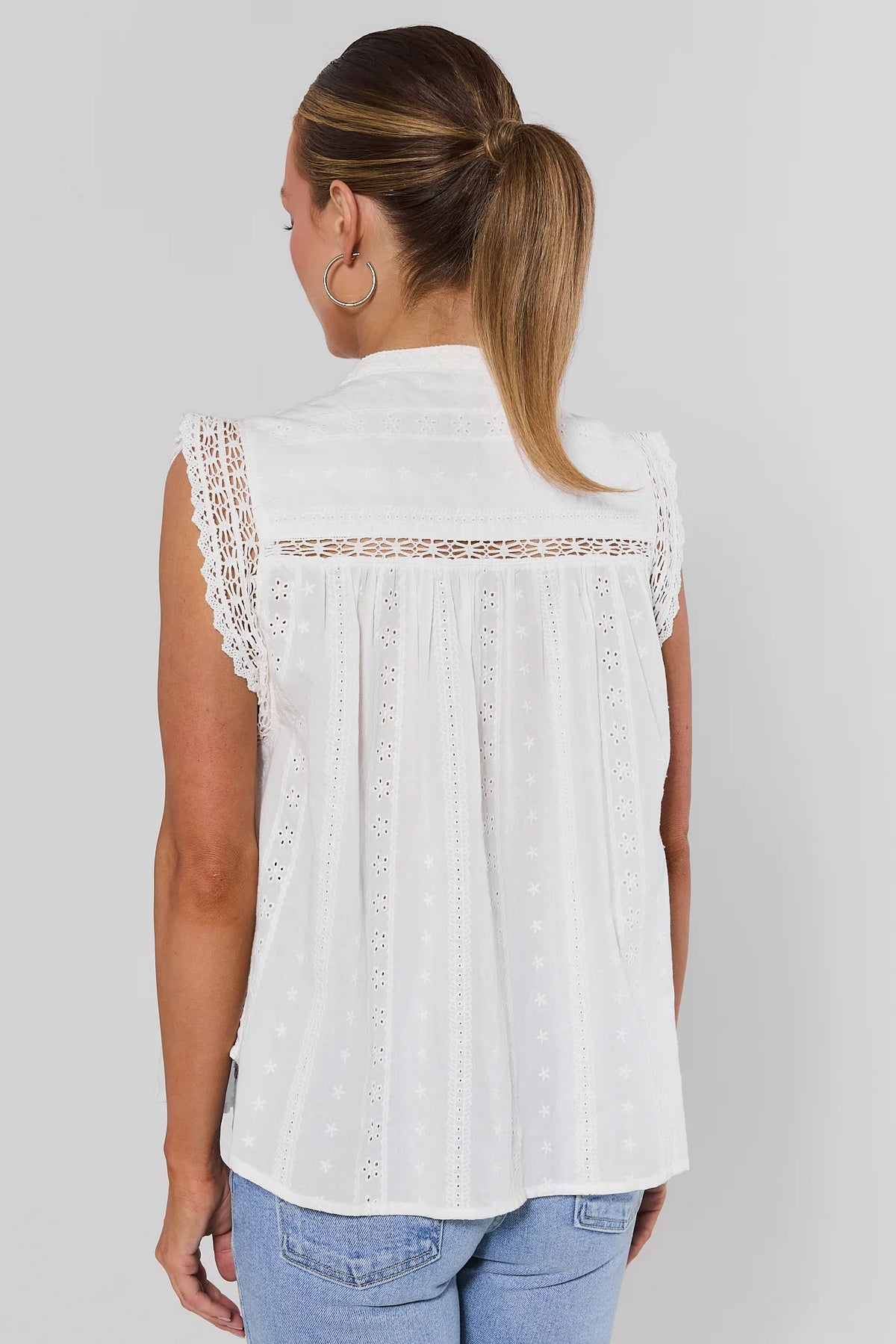White eyelet embroidered top back view showing lace trim and eyelet embroidery detail | Avara