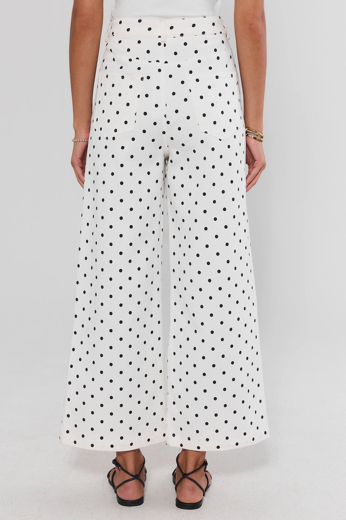 Black and white polka dot wide leg jeans, back view showing back pockets and full leg sweep | Avara