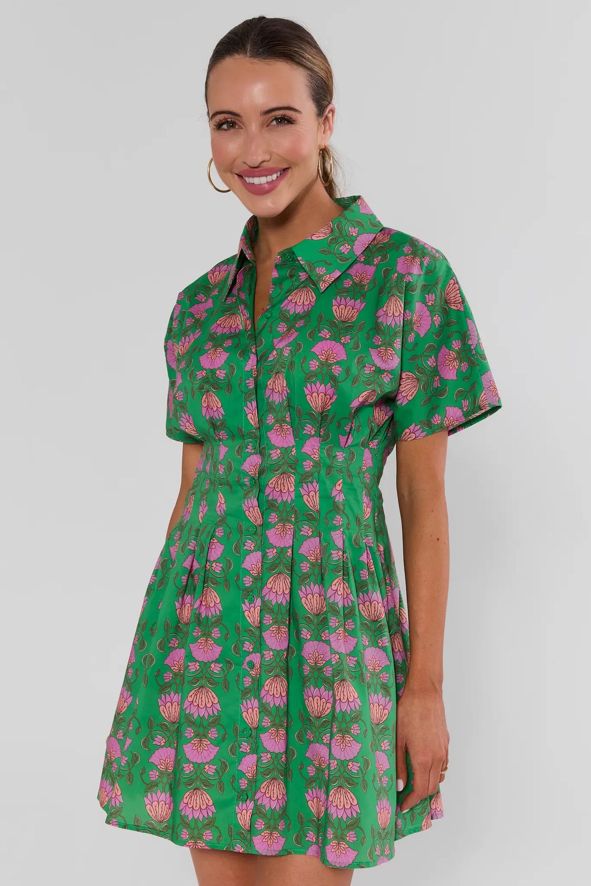 Woman wearing green pink floral button up short dress - Three-Quarter Front View | Avara