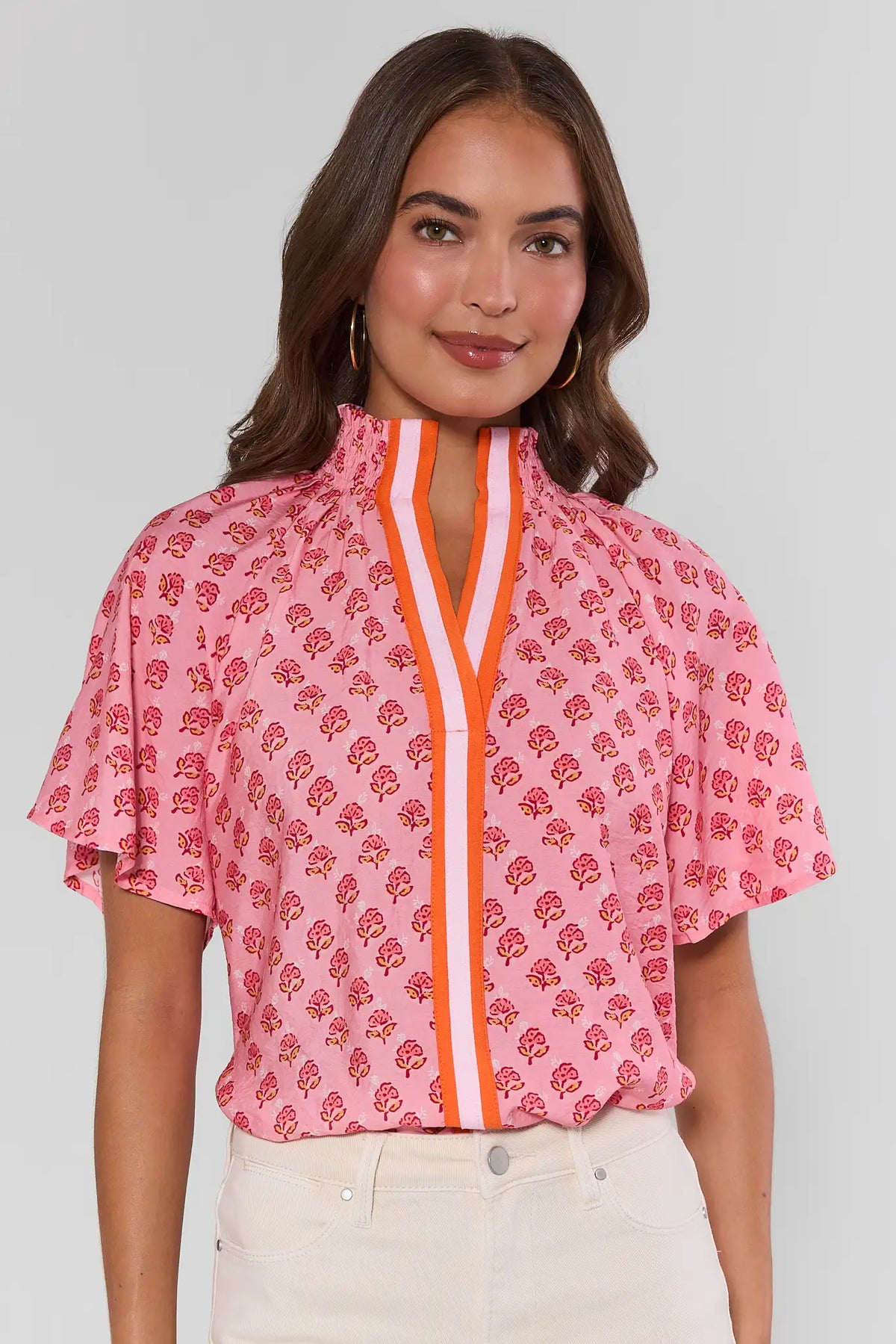 Pink floral block print THML top with orange contrast trim, flutter sleeves - Front View | Avara