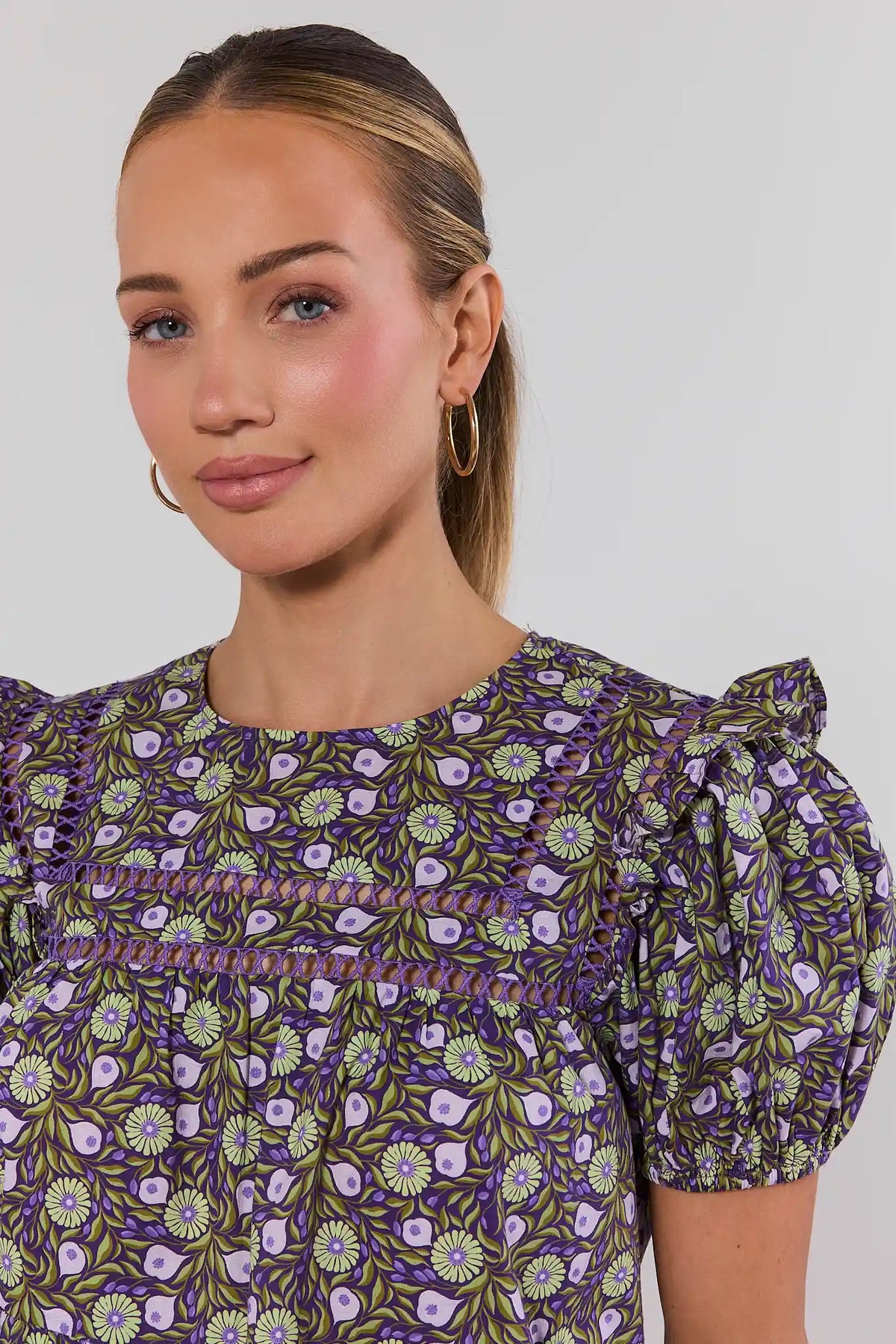 Maggie Purple Floral Top showing crochet trim detail and round neckline - Close-Up Detail | Avara