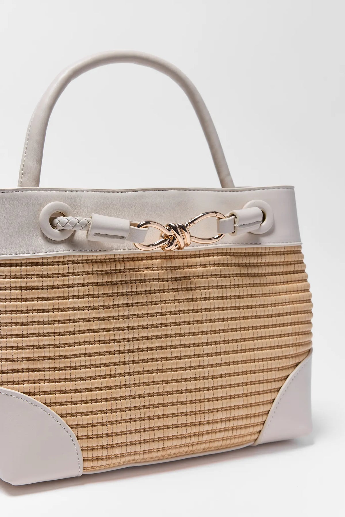Tan Raffia White Trim Bag gold knot closure and woven texture detail - Close-Up | Avara