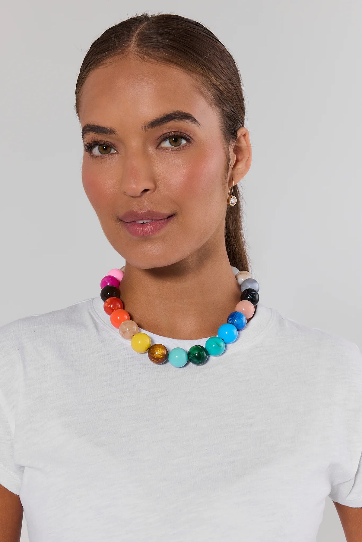Woman wearing multicolor resin beaded necklace over white tee - On Model Front View | Avara