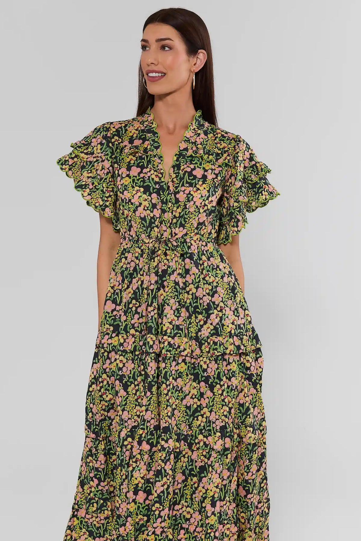 Carly Multi Printed Scalloped Maxi Dress in black floral, tiered skirt, flutter sleeves, styled with woven bag | Avara