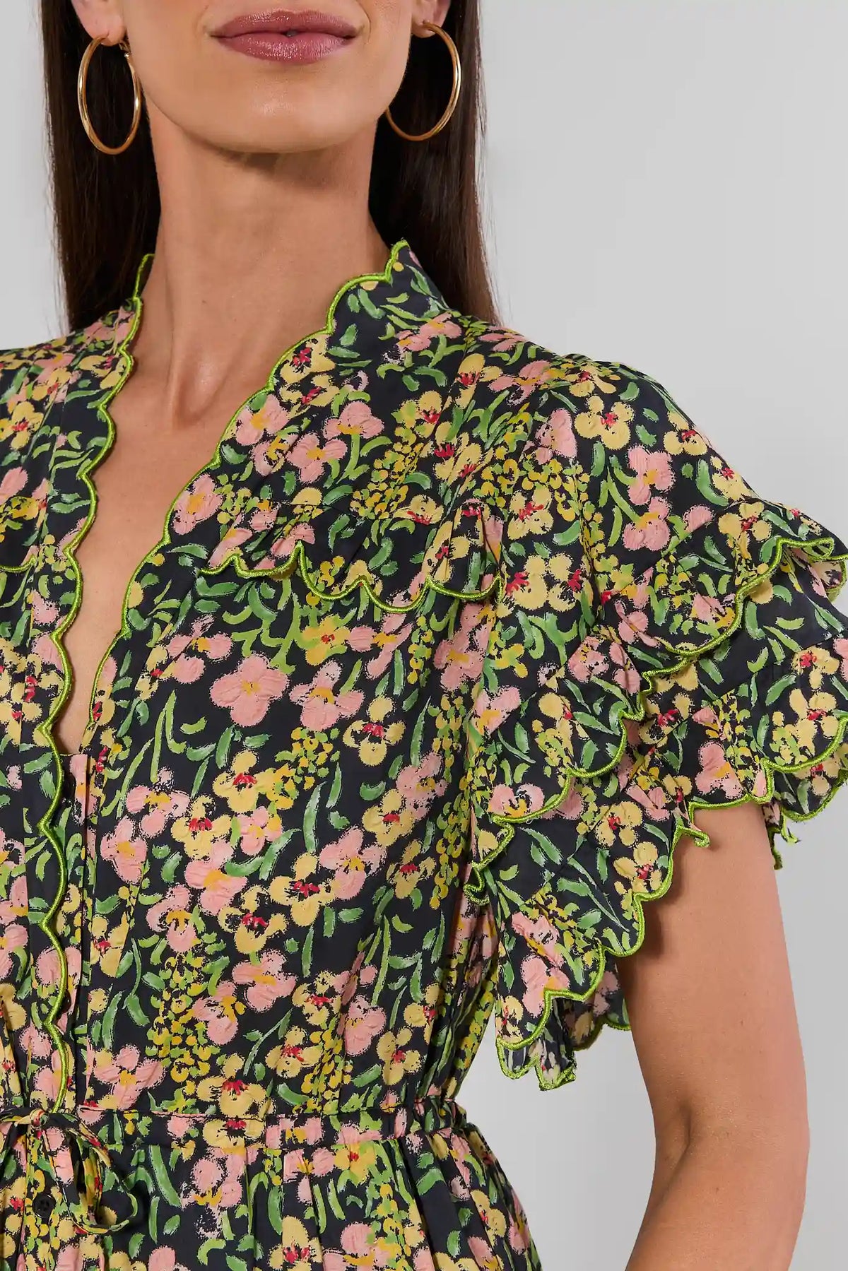 Carly Multi Printed Scalloped Maxi Dress close-up detail of scalloped ruffle sleeves and V-neckline with neon trim | Avara