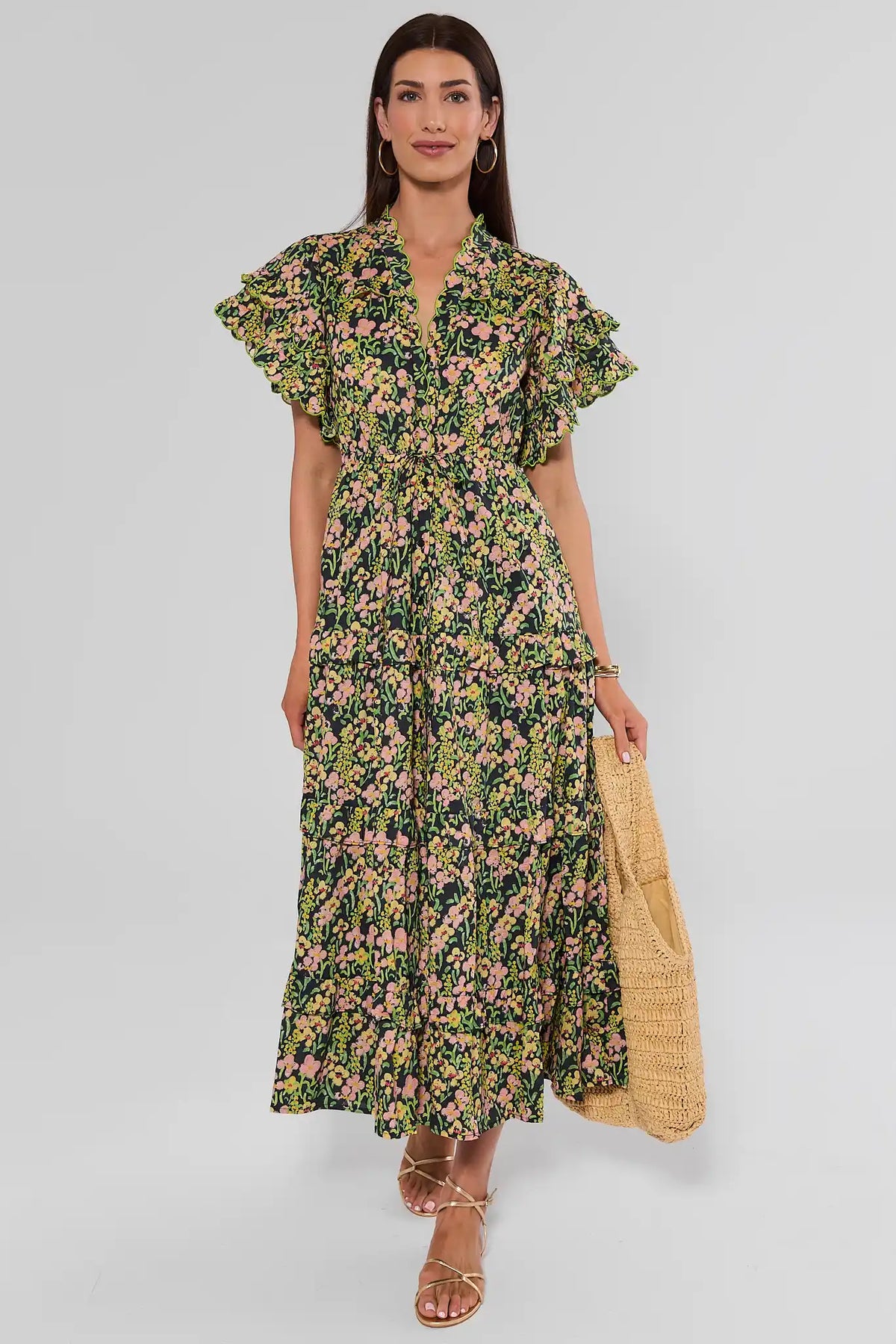 Carly Multi Printed Scalloped Maxi Dress front view, black floral print, tiered maxi skirt, gold sandals | Avara