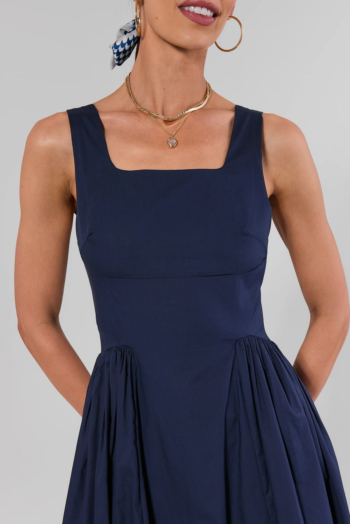 Navy gathered maxi dress square neckline and structured bodice close-up detail, on model | Avara
