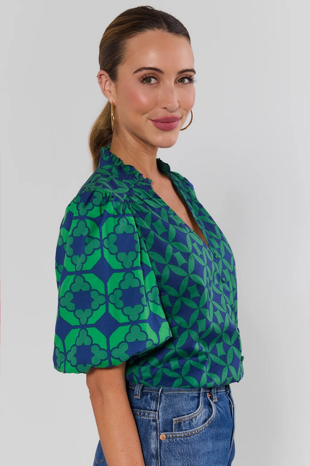 Rebecca Green Printed Puff Sleeve Top with ruffle split neck - Side View paired with denim | Avara