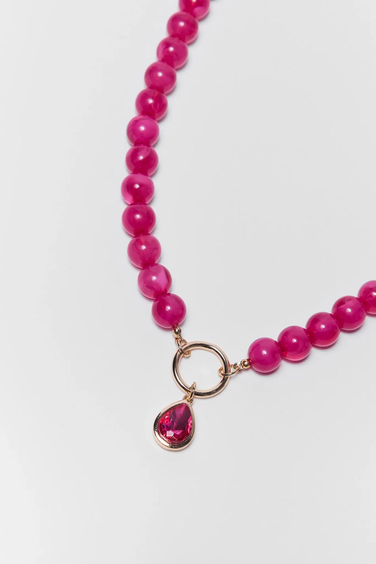 Pink Stone Drop Necklace Gold Ring & Teardrop Rhinestone Pendant - Close-Up Detail | Avara