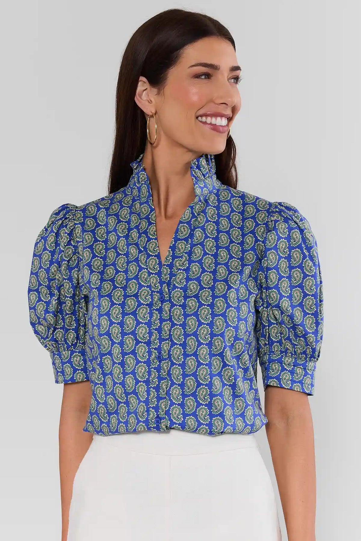 Woman smiling wearing Gracie Blue Paisley Print Top, puff sleeves, ruffle neck, front view | Avara