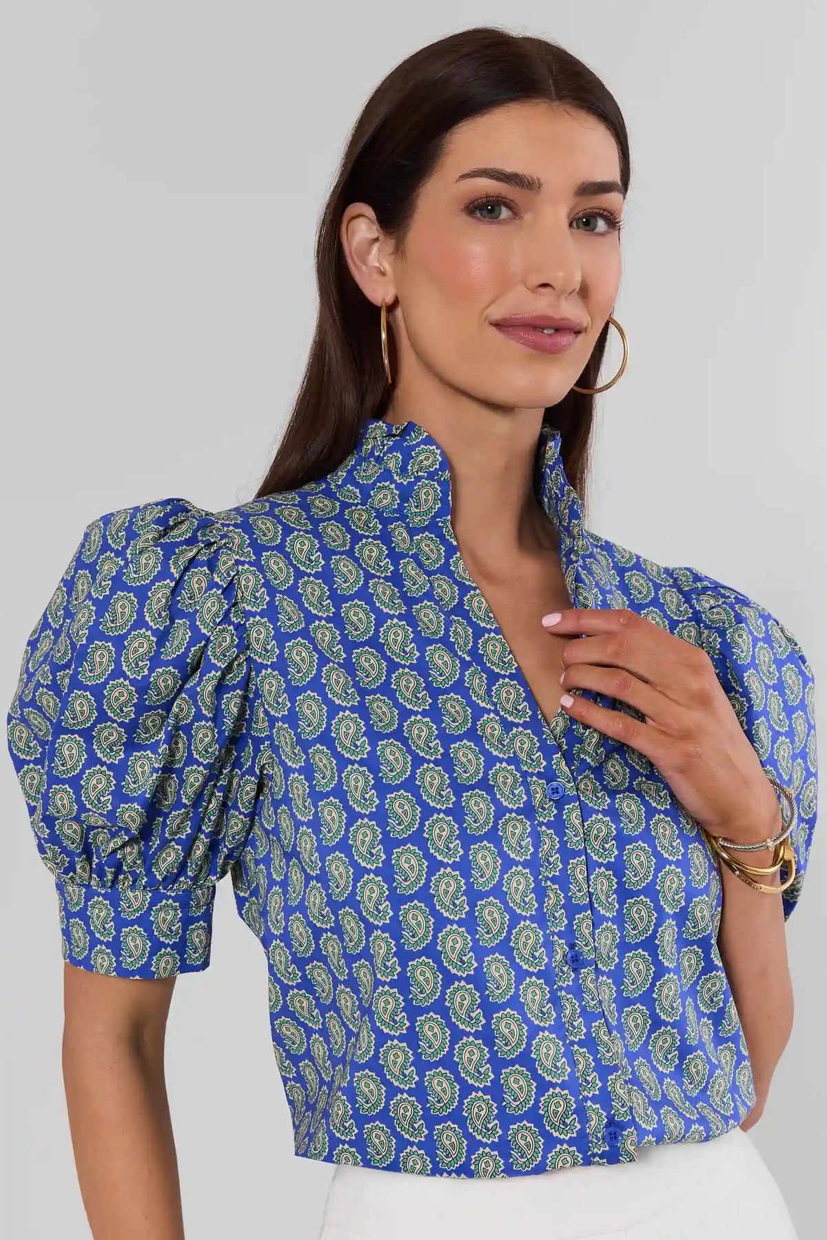 Woman wearing Gracie Blue Paisley Print Top, puff sleeves and button front, three-quarter view | Avara