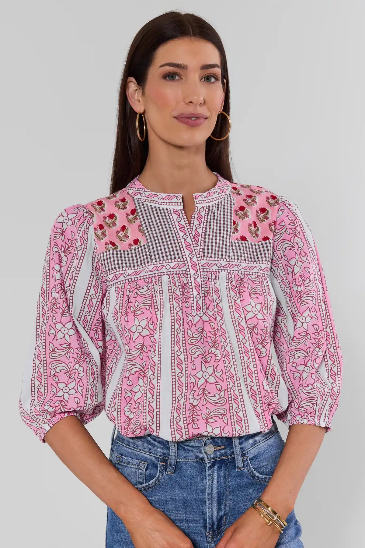Pink mixed-print split neck top by THML with gingham yoke and floral patchwork, front view styled with denim | Avara