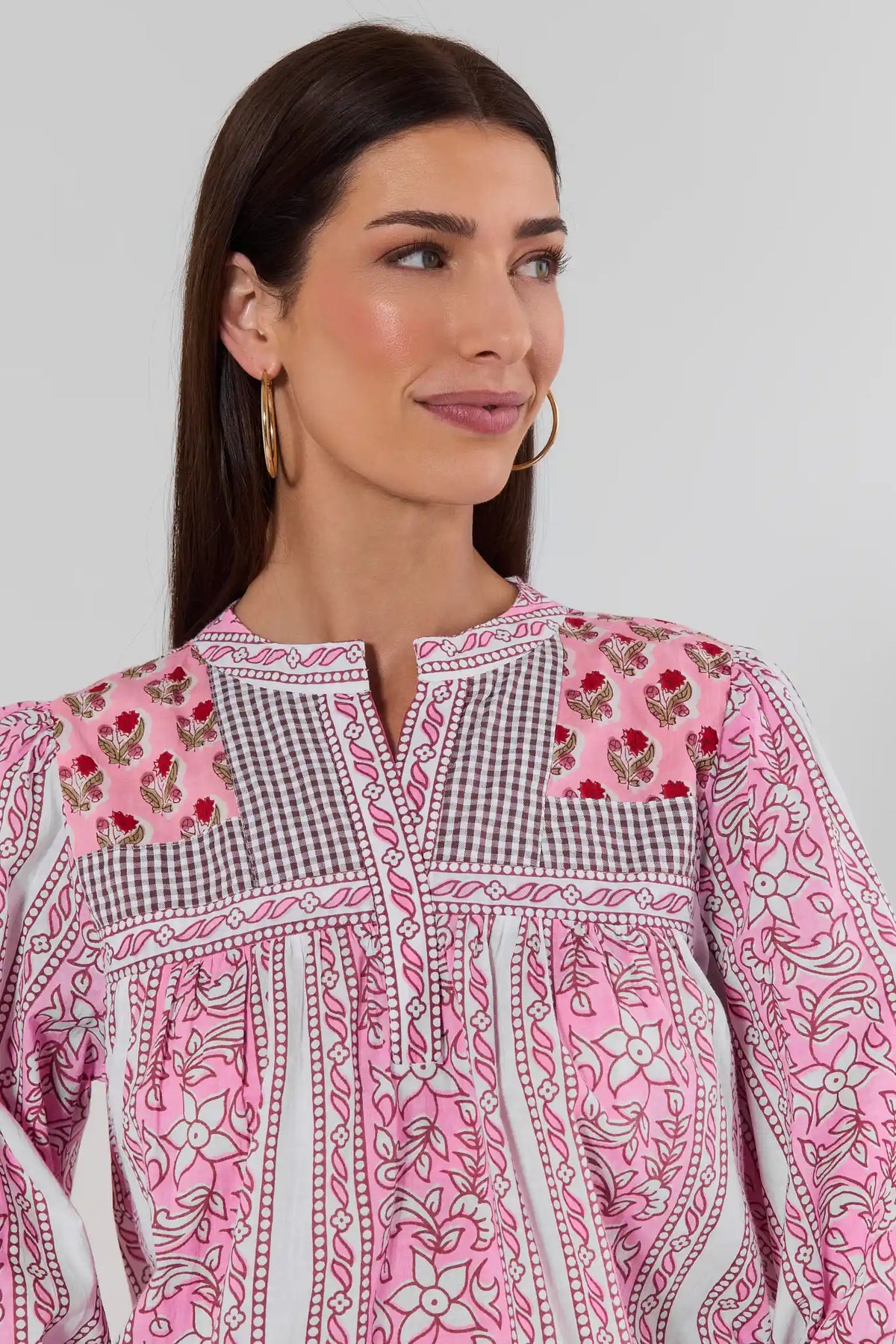Close-up of pink patchwork print top by THML showing split neckline, gingham panel, and floral print detail | Avara
