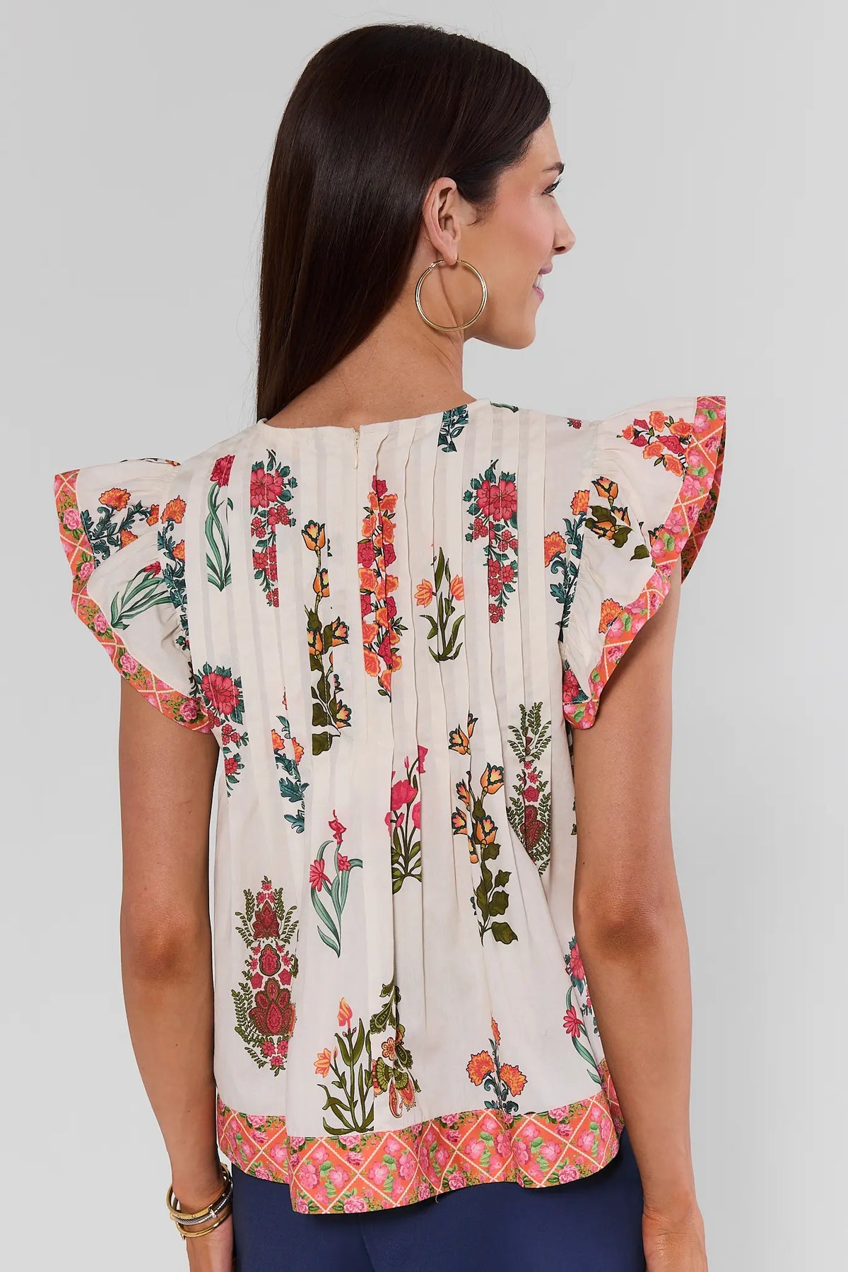 White Floral Printed Top by THML with ruffle sleeves and contrast floral hem trim - Back View | Avara