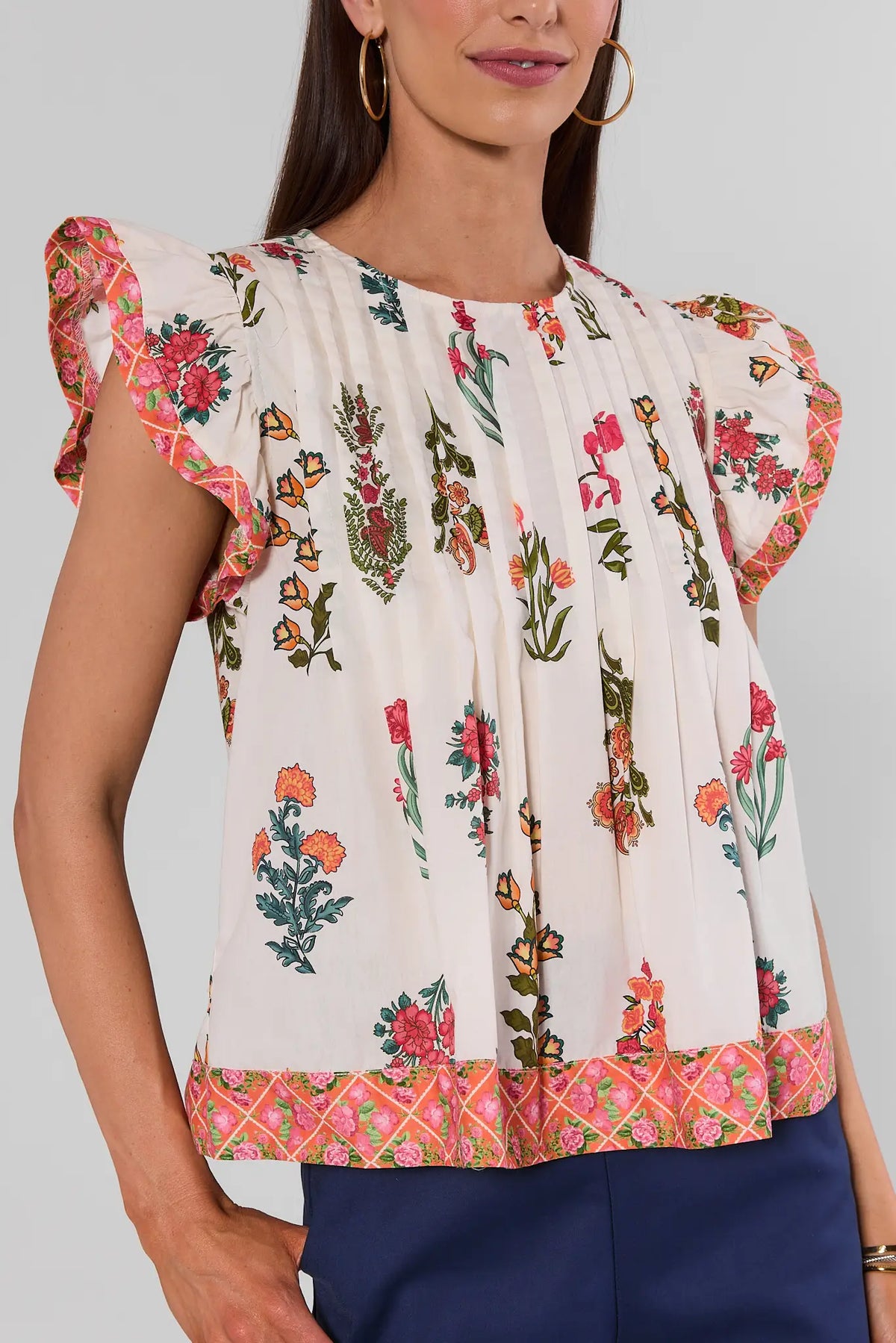 White Floral Printed Top by THML with pintuck pleats and pink contrast border trim - Close-Up Detail | Avara