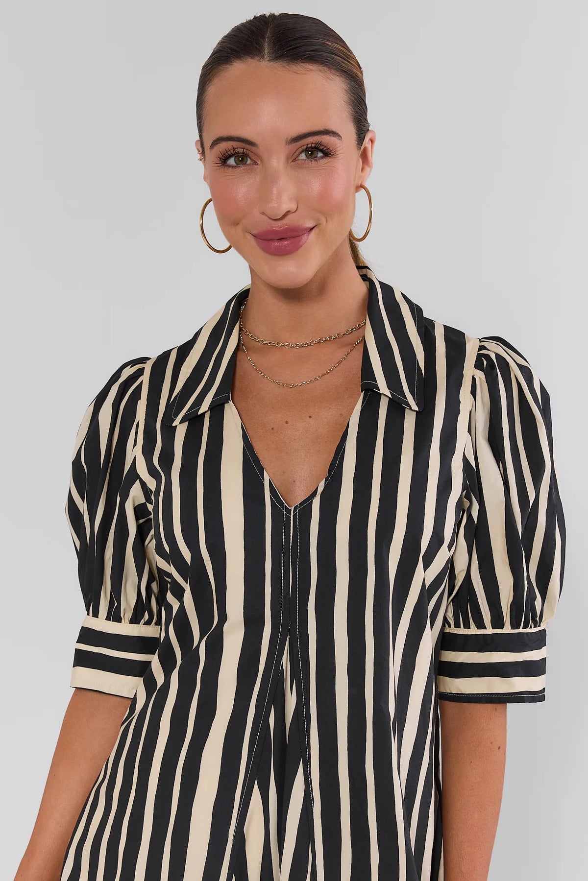 Close-up of Isla Black Striped Midi Dress puff sleeve and V-neckline detail, collared black stripe dress | Avara