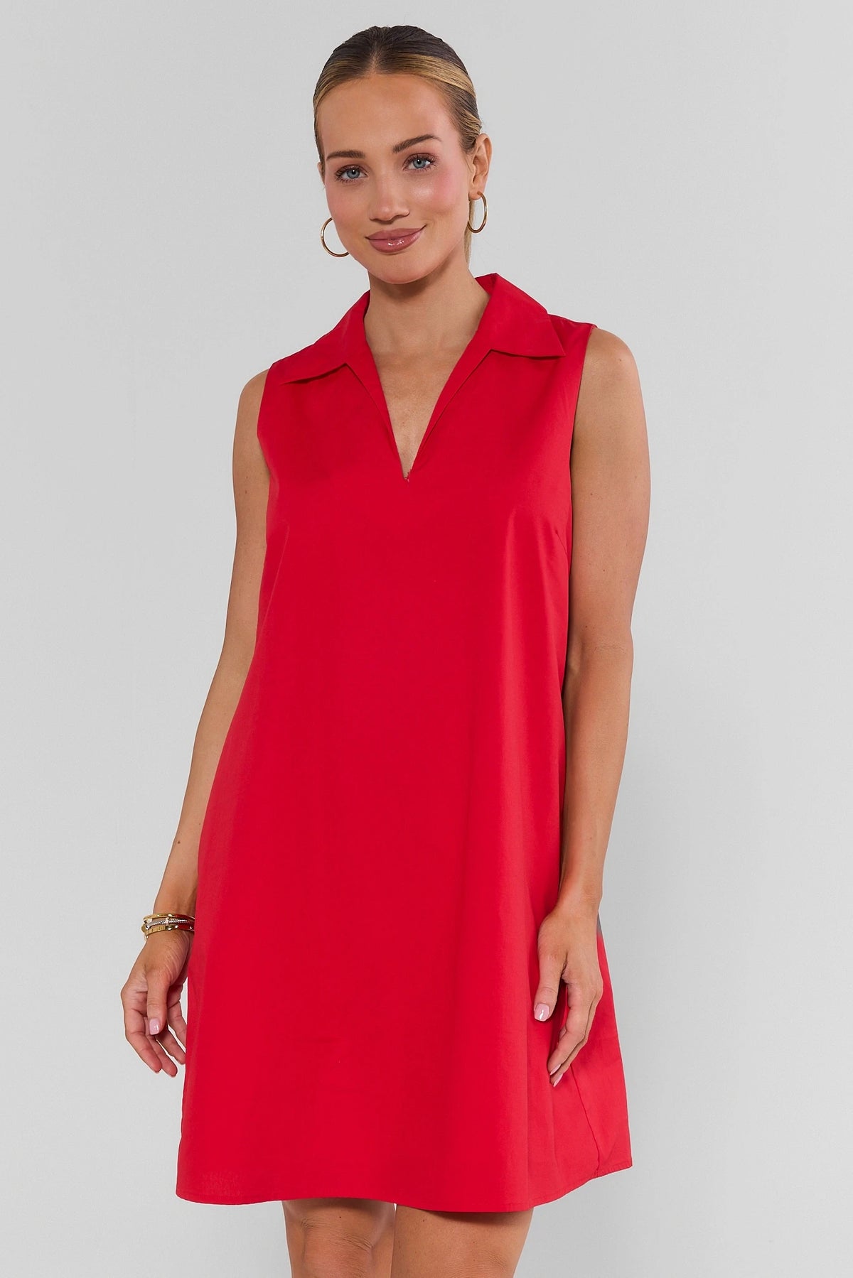 Woman wearing red Ellen Short Dress with collared V-neck shift silhouette - Front View | Avara
