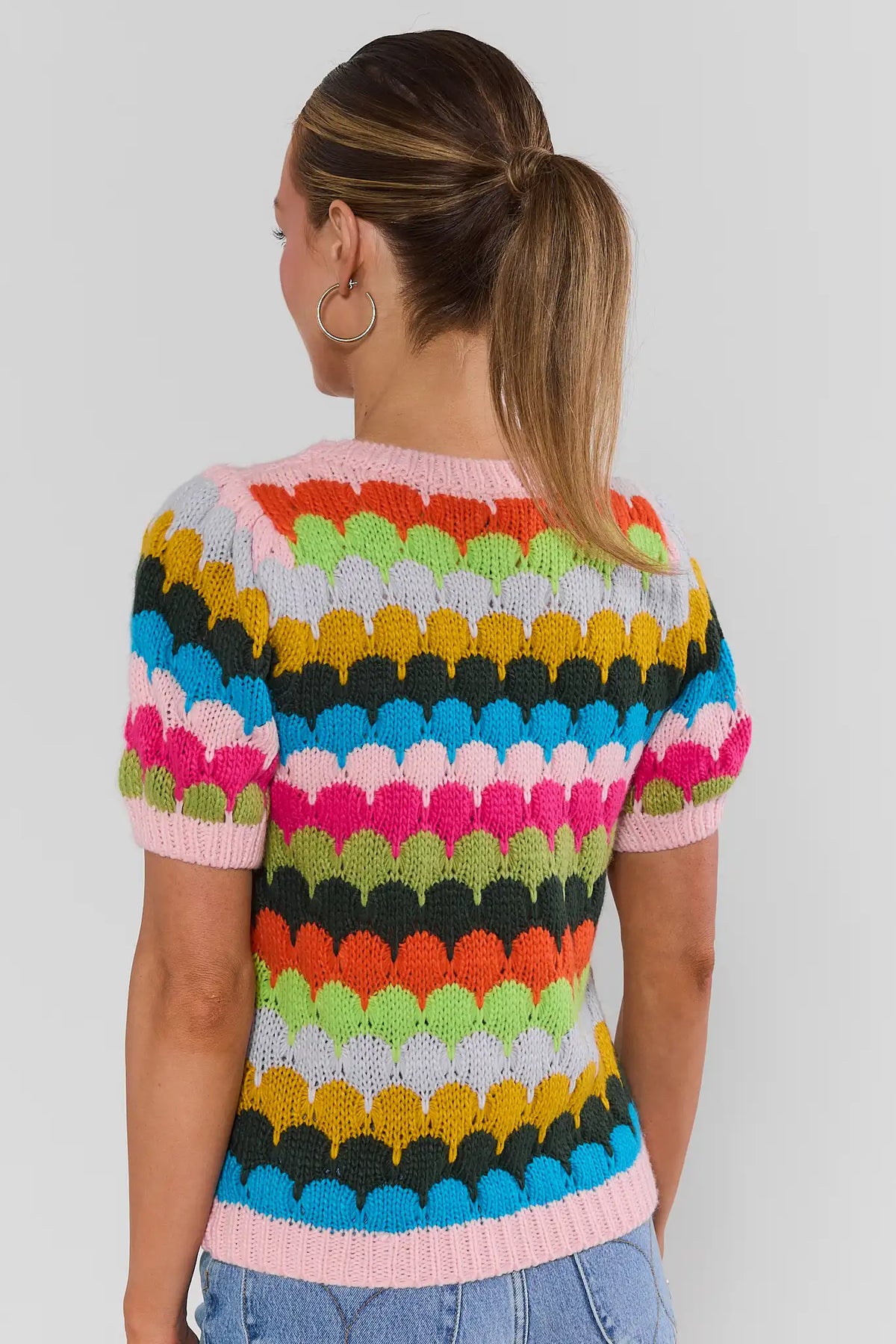 Woman wearing Trina Multi Striped Knit Top - Back View, multicolor scallop stripe short-sleeve knit top for women | Avara