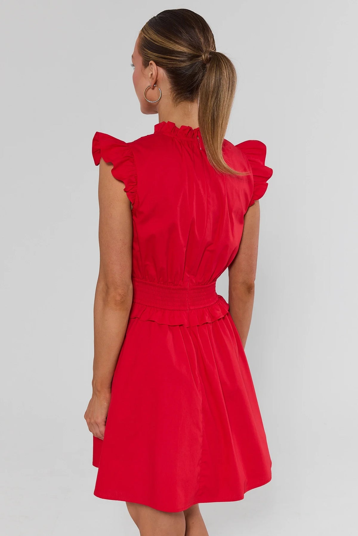 Makayla Red Flutter Sleeve Short Dress - Back View showing flutter sleeves, smocked waist, and zip closure | Avara