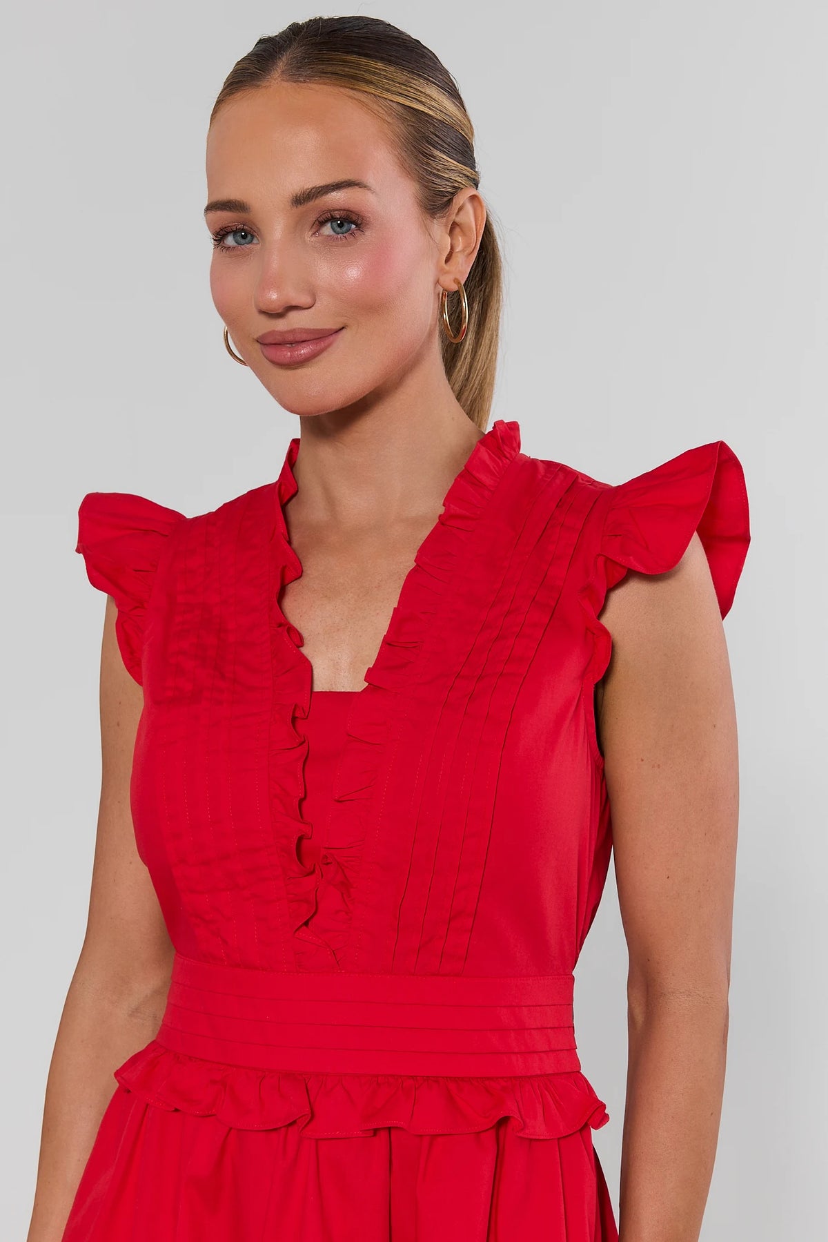 Makayla Red Flutter Sleeve Short Dress - Close-Up of ruffle V-neckline, flutter sleeves, and pintuck bodice | Avara