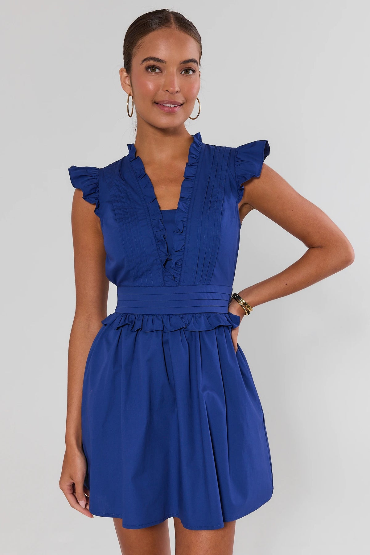Makayla Blue Flutter Sleeve Short Dress, front view – royal blue ruffle neckline, pleated bodice, a-line skirt | Avara