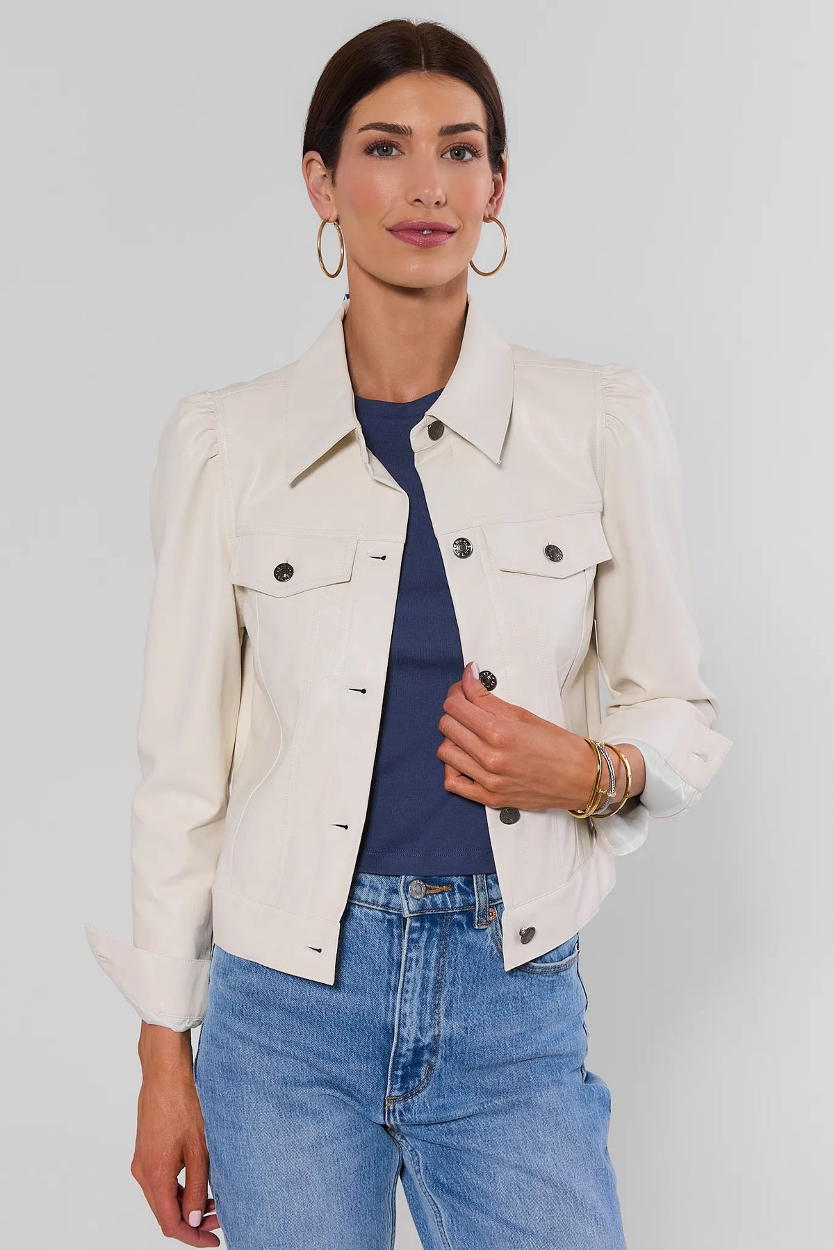 Roxanna Cream Faux Leather Jacket - Front View On Model with jeans, puff shoulder and button detail | Avara