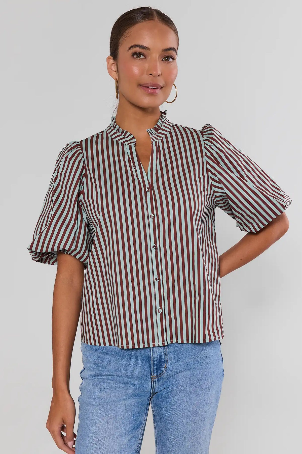 Brown & mint vertical stripe short-sleeve button-up top by THML paired with light wash jeans - Side View | Avara