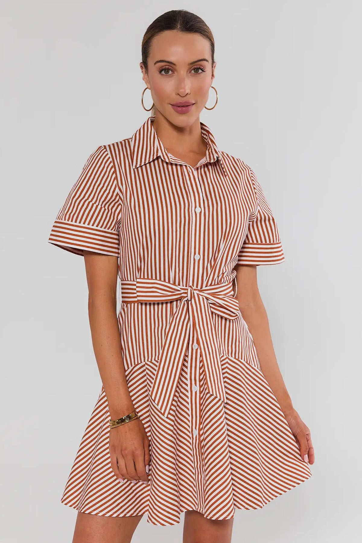 Millie Rust Striped Short Dress full-length front view, styled with white sneakers and black crossbody bag | Avara