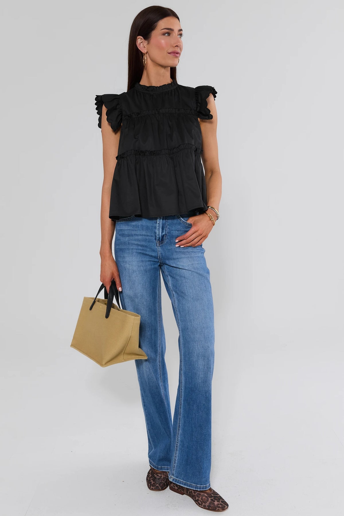 Black flutter sleeve top styled with wide leg jeans and tan tote - Full Length Styled Look | Avara