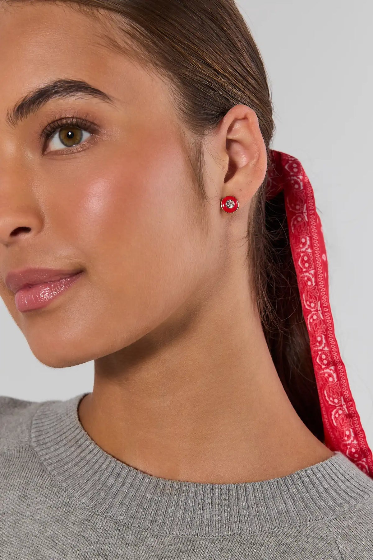 Woman wearing red enamel rhinestone stud earrings with a red bandana hair tie - On Model Close-Up | Avara