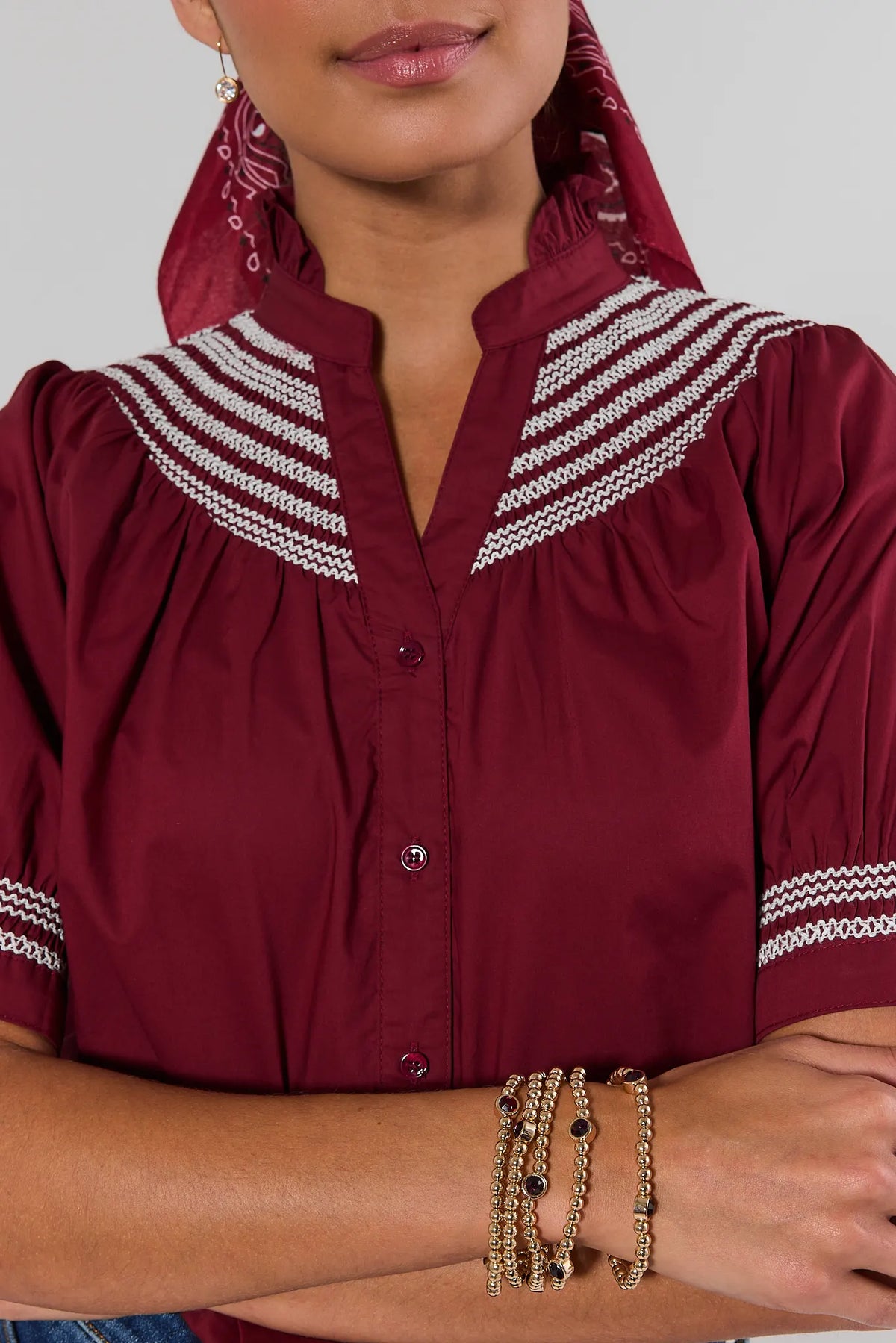 Woman wearing Gold Beaded Maroon Rhinestone Bracelet Set stacked for game day | Avara