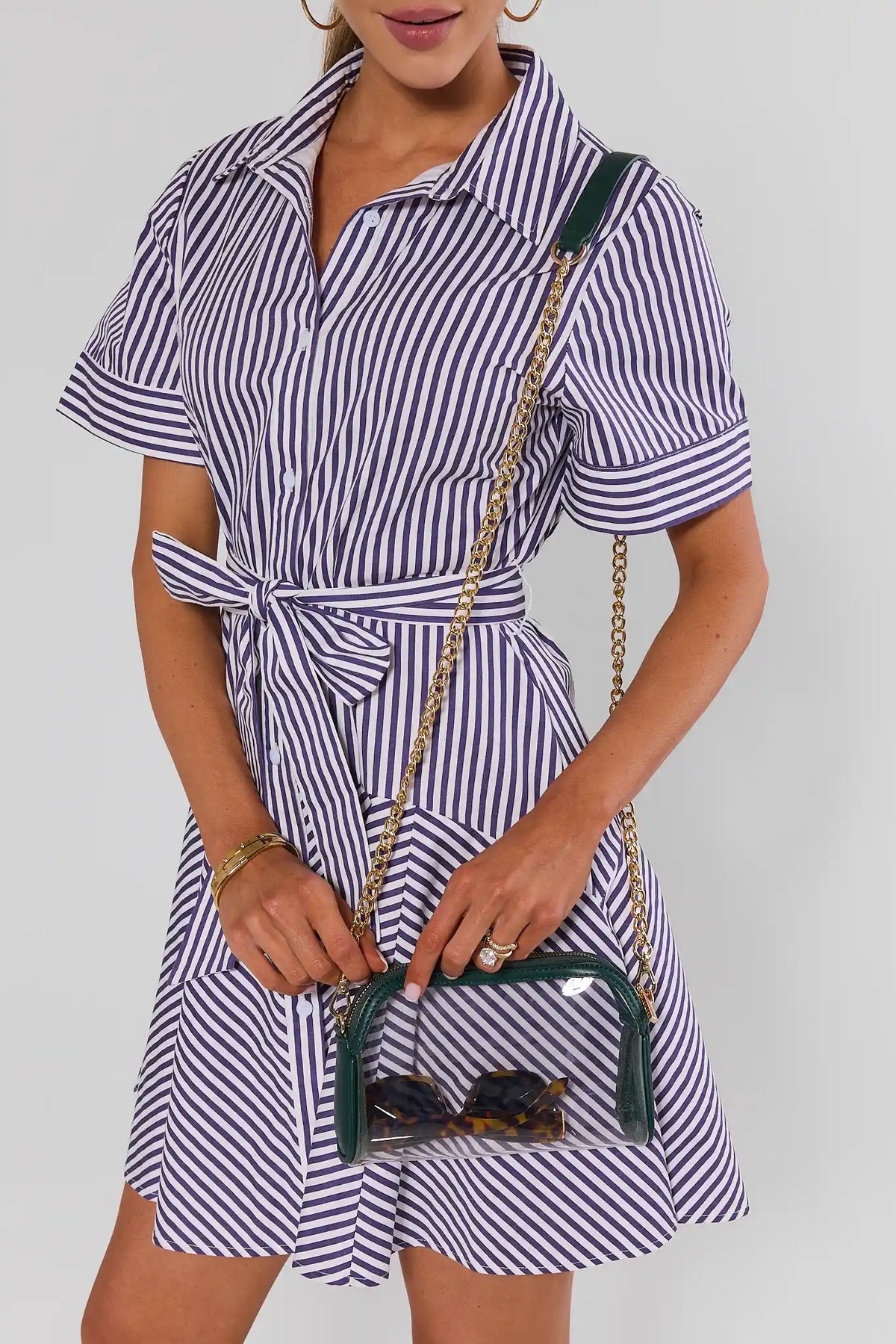 Green clear crossbody bag styled on model in navy striped shirt dress - On Model | Avara
