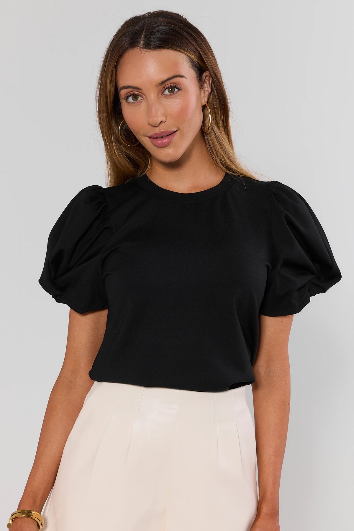 Black puff-sleeve crewneck tee with white high-waisted trousers - Front View | Avara