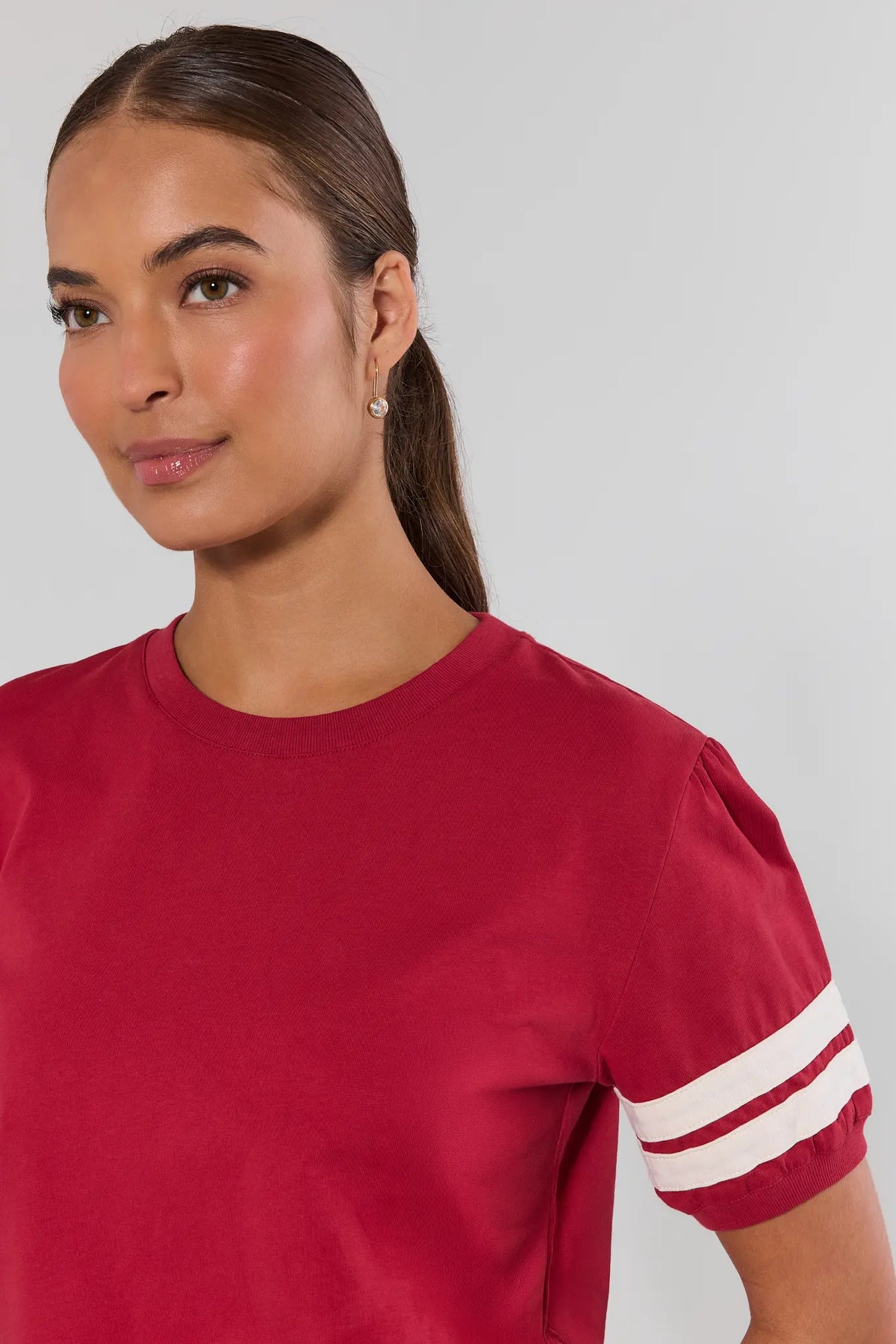 Alice Burgundy Striped Sleeve Tee close-up showing varsity stripe sleeve detail and crewneck | Avara
