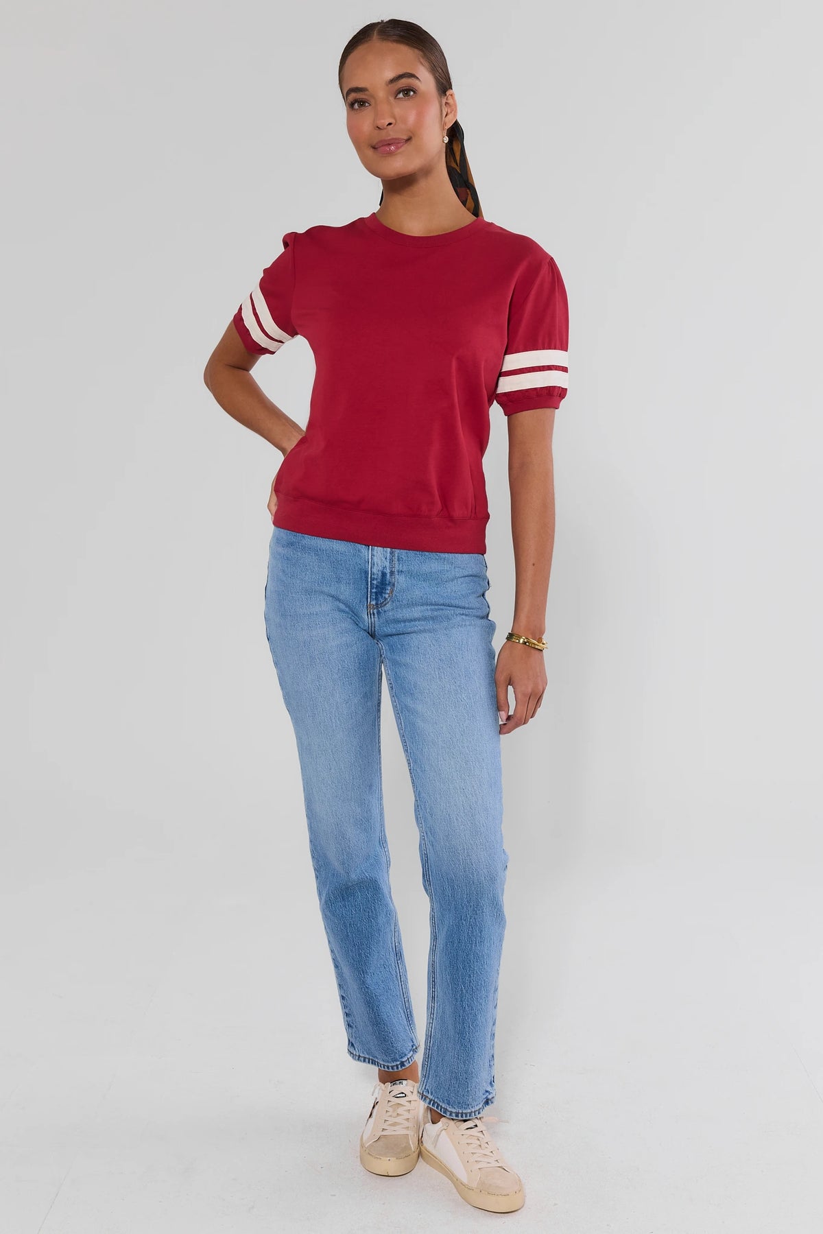 Alice Burgundy Striped Sleeve Tee three-quarter view with white varsity stripes, women's game day top | Avara