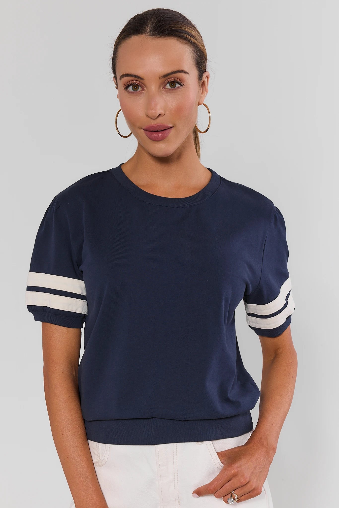 Alice Navy Striped Sleeve Tee - Front View, paired with white wide-leg pants | Avara
