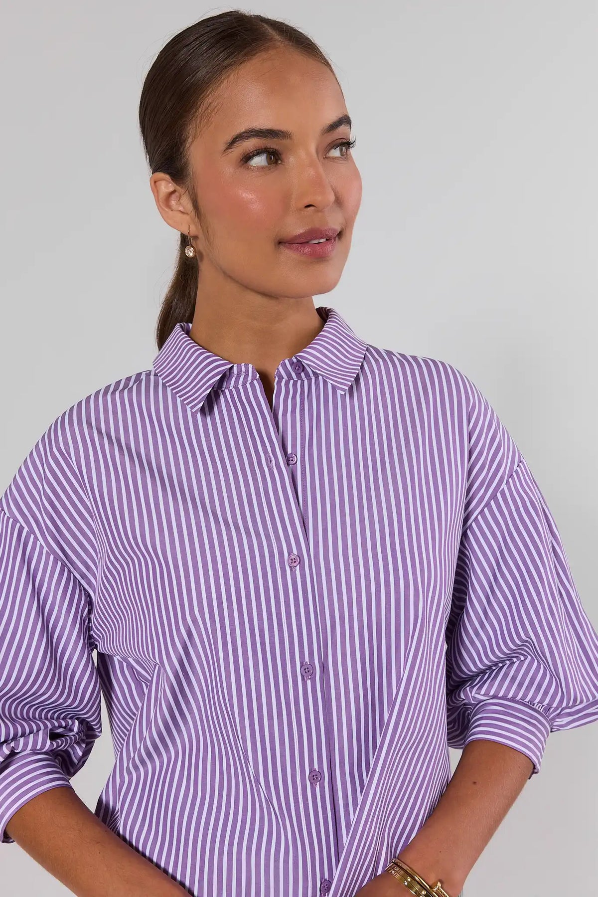 Purple striped button-down top close-up showing spread collar and button front detail - Face Detail | Avara